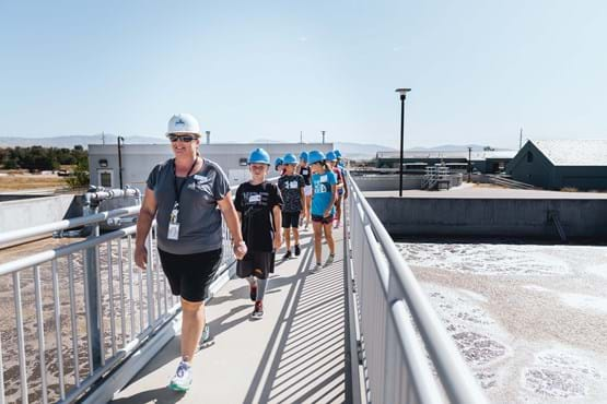 people walking at the water treatment plant