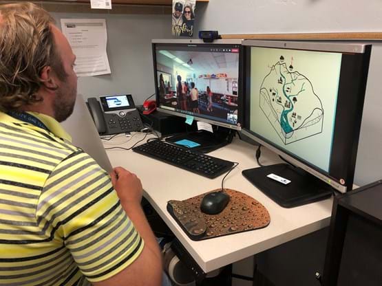 man in front of computer for virtual field trips