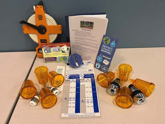 Cups, measuring tape,  water measuring kit, and instructions