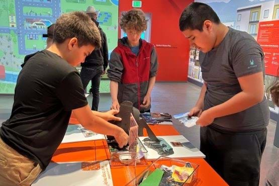 Children interact with Innovation Station exhibit.